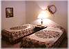 One of the bedrooms with two twin beds