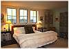 The lower level bedroom with a king size bed.