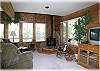 The living room has a television, satellite service and VCR with videos.