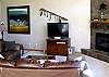 Wonderful living room with a gas fireplace, flat screen TV with DVD player and gorgeous views out the windows