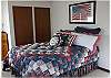 Upstairs bedroom with a queen size bed