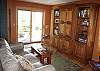Cozy room off the kitchen with a television in the armoire