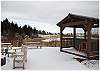 The gazebo and hot tub with the pond in the background.