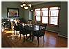 A beautiful dining area off to the side of the kitchen seats eight comfortably