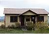 The guest cabin has two bedrooms each with one double bed and two baths.