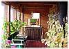 The sun room area just off the living room and kitchen