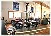 The dining area is open to the kitchen on one side and living room on the other
