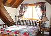 Master bedroom on second level with queen size bed and private bath