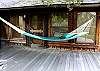 Relax in this large hammock on the deck of the Boulder River Cabin.  Hung seasonally as weather allows.