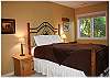 One of the lower level bedrooms with queen size bed
