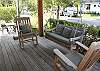 Charming front porch with a bench swing
