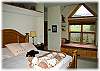 The master bedroom has a california king bed
