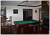 Billiards and game room with a pool table and gas fireplace