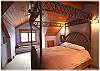 Upstairs bedroom with a queen size bed