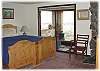Another look at the master bedroom - with doors out to the porch sitting area