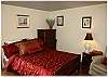 Upstairs bedroom with a queen size bed