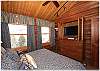 Guest bedroom on the second floor with flat screen tv