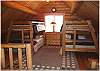 Loft with two sets of bunk beds and a sitting area