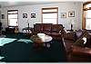 Sink into the leather sofas in the living room