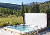 Hot tub off the back patio with amazing views.