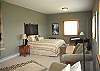 The second bedroom with a seating area