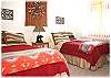 A bedroom with two twin beds