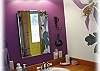Fun murals throughout the house including the bathroom