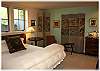 Original artwork and beautiful Chinese screens in the lower level bedroom
