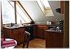 The apartment has its own complete kitchen