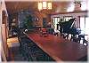 The dining room adjoins the living room and features a piano!