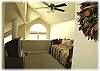 Upstairs loft area with television and a bed that pulls out into a king size bed