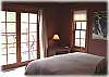 Another view of the master bedroom with a porch right outside