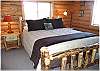 Main level bedroom with a queen size bed