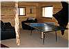 The lower level of the home has a rec room with ping pong table