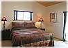 Spacious master bedroom with king size bed and private bath