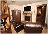 The bunk room is a great place to sit and watch tv with the warmth of the gas fireplace