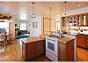 Another view of the spacious kitchen with a side breakfast table