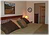 Master bedroom with king size bed and private bath