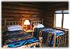 One of the main level bedrooms with two twin beds