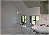Each bedroom has a bath with tub and shower