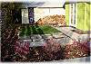 A small backyard area where guests can catch some sunshine or have a barbecue