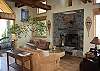 Living room with grand fireplace