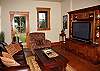 Lower level family room with huge flat screen tv and access to the back lawn