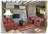 Another look at the large living room which has fireplace seating as well as a tv corner