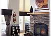 A wonderful fireplace in the bright living room