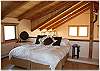 Master bedrooom in the loft with a king size bed