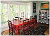The dining area has bay windows looking out to the aspen trees