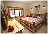 Second downstairs bedroom with a king size bed