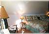 The upstairs bedroom in the home with two double beds