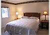 Lower level bedroom with queen bed and private bath